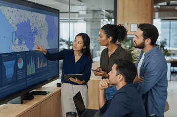 Small fiber operations team reviewing a live coverage map and order pipeline during network launch