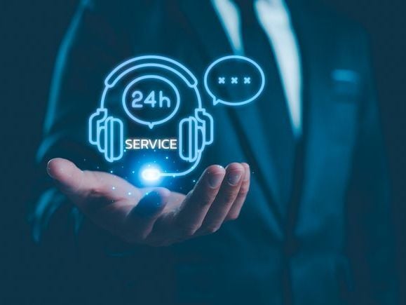 hand of man showing 24 hour service icon